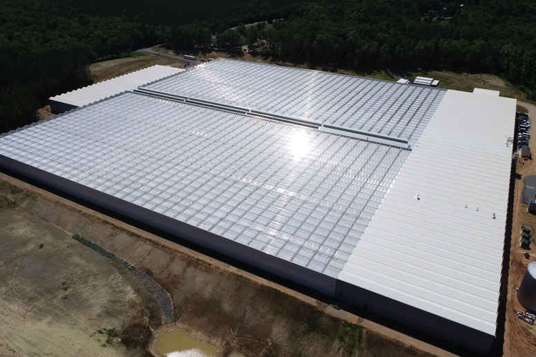 Aerial view of the Better Future Farms turnkey greenhouse built by Van der Hoeven in Australia, featuring large glass-covered structures for modern horticultural production.