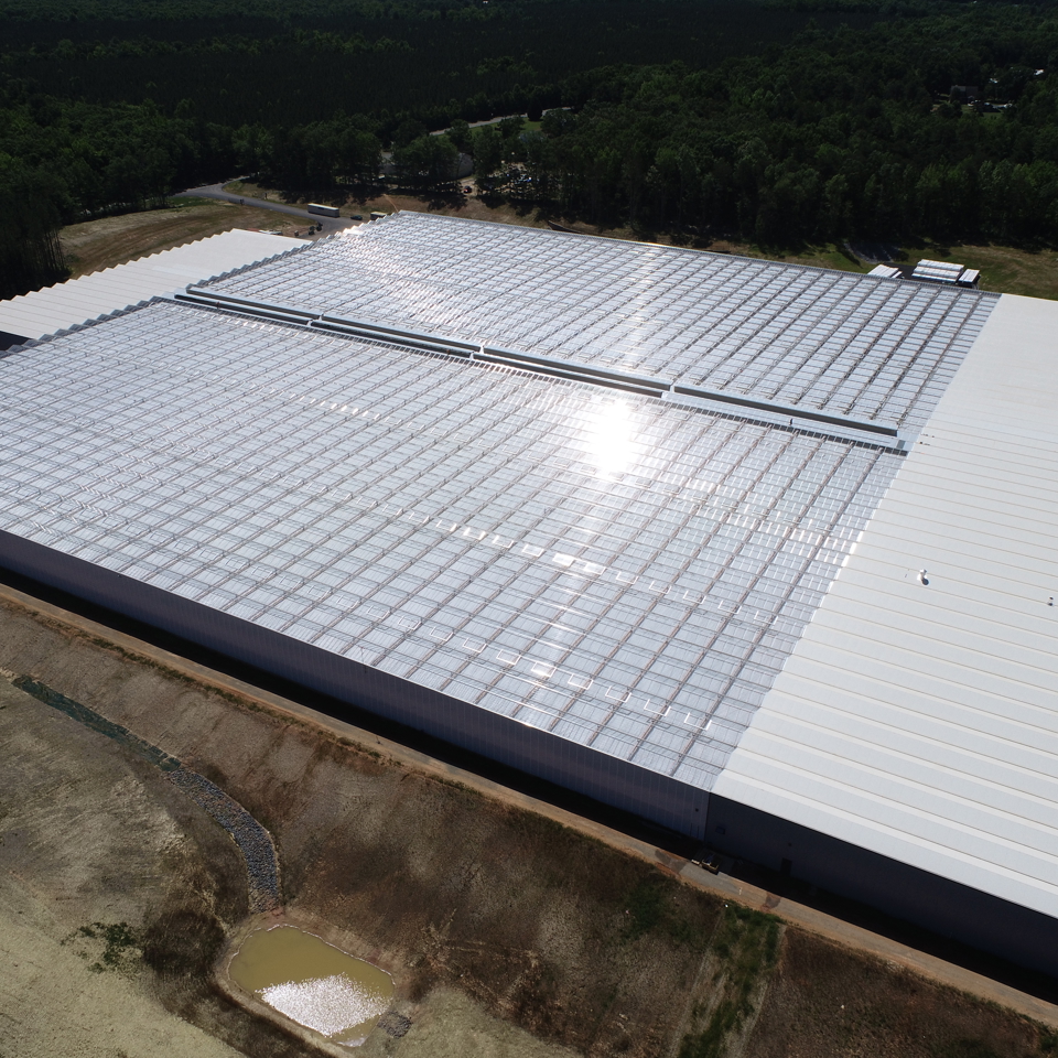 Aerial view of the Better Future Farms turnkey greenhouse built by Van der Hoeven in Australia, featuring large glass-covered structures for modern horticultural production.